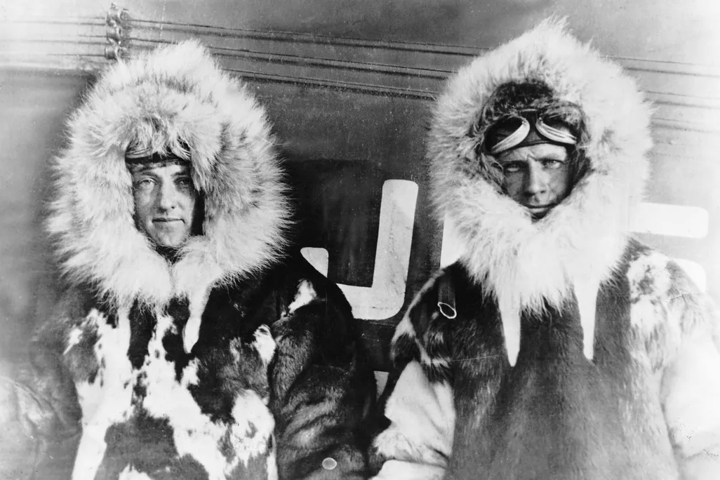 Richard E. Byrd (left) and Floyd Bennett (right) wearing fur parkas, circa 1926
