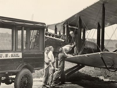 Loading mail onto a de Havilland DH-4 mail plane, Omaha, Nebraska, mid-1920s