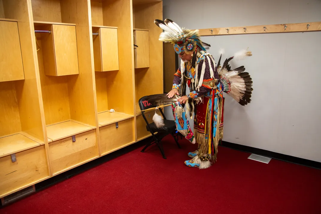 12 - Bart Stevens, a Northern Traditional Powwow dancer, prepares his regalia in a locker room before the annual University of Utah Powwow in Salt Lake City.