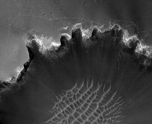 The Opportunity Mars rover prepares to descend into a deep crater.
