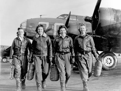 Frances Green, Margaret (Peg) Kirchner, Ann Waldner and Blanche Osborn leaving their plane, "Pistol Packin' Mama," at the four-engine school at Lockbourne AAF, Ohio, during WASP ferry training. 