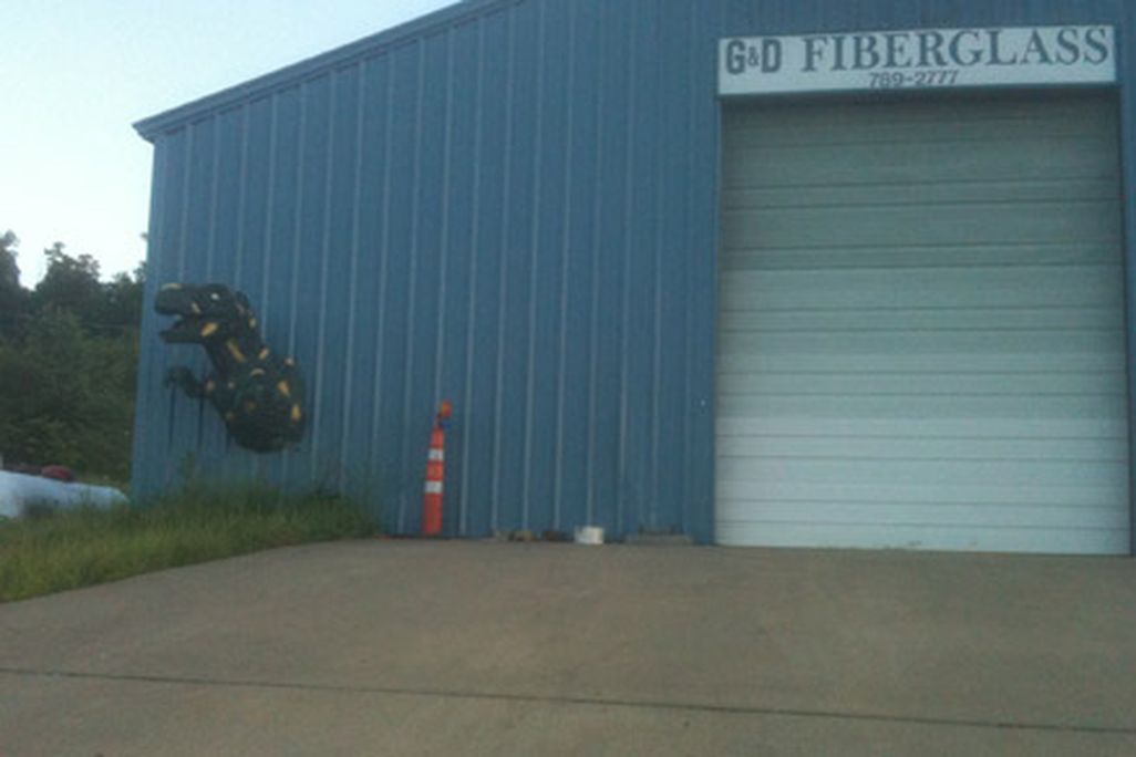 A Tyrannosaurus busting out of a fiberglass shop near Hindsville, Arkansas