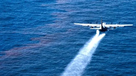 An Air Force plane sprays dispersant onto the Gulf of Mexico following the Deepwater Horizon spill. New research could produce safer dispersants that include ingredients found in food.
