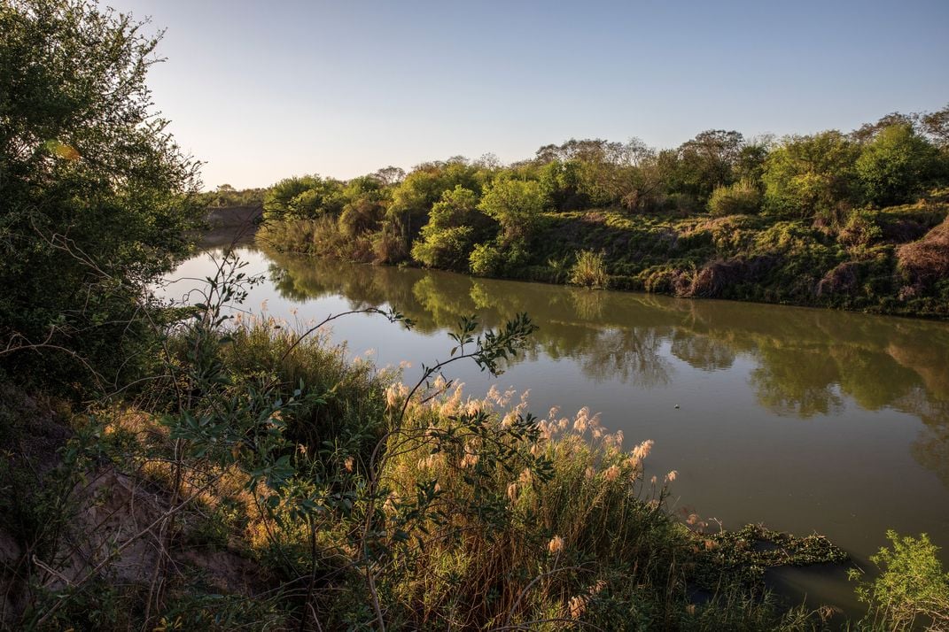 a section of the Rio Grande with  water and brush