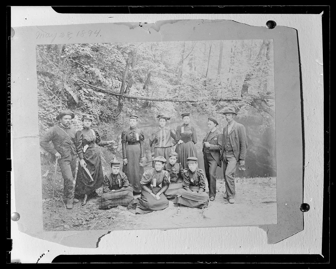 Copy of an 1894 photograph of a guide and a group of visitors to Mammoth Cave