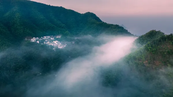 The village surrounded by mist thumbnail