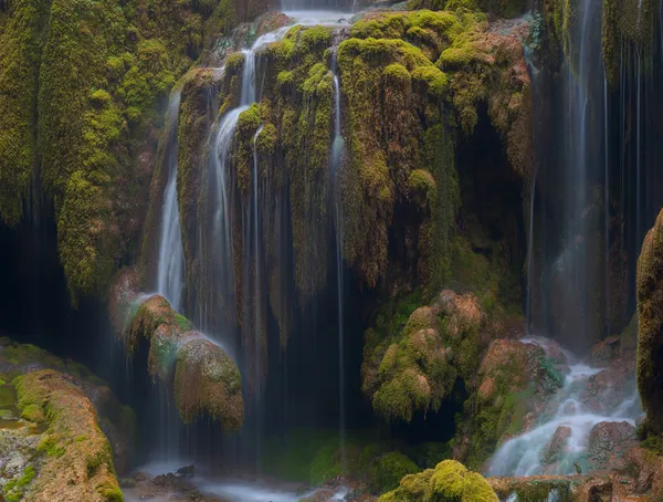 Mossy waterfall in deep valley 8 thumbnail