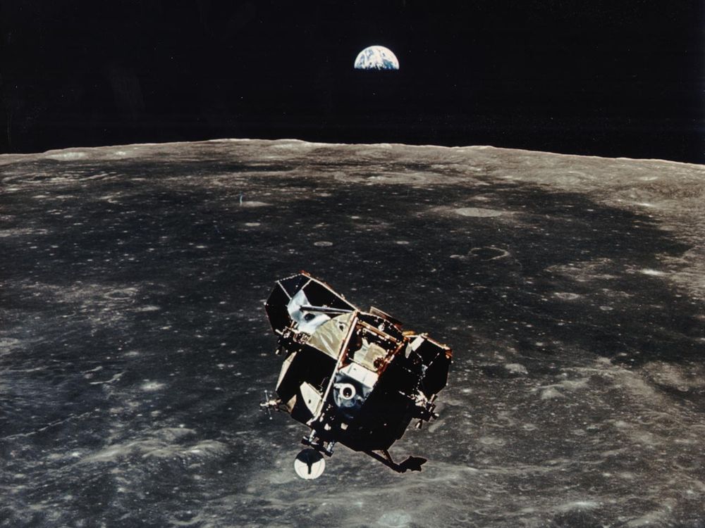 Apollo 11 ascent stage aloft above Earth with the moon rising in the distance