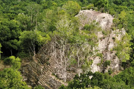 The peak of La Danta—one of the world's largest pyramids—pokes through the forest canopy. "All this was abandoned nearly 2,000 years ago," says archaeologist Richard Hansen. "It's like finding Pompeii."
