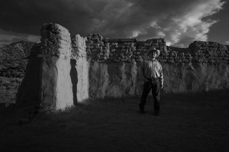 Genízaro Delvin Garcia standing in remains of the 18th-century Santa Rosa de Lima Church. Abiquiú, New Mexico, 2019. (© 2020 Russel Albert Daniels) 
