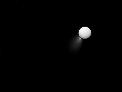 Light reflecting off Saturn illuminates the plumes shooting out of Enceladus in this 2013 Cassini image.