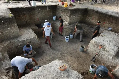 Experts think the cross-shaped pit reflects the Maya view of the universe.