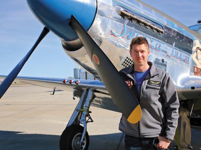 At Bemidji Airport, Erik Hokuf stands with a recent project, the P-51D Sierra Sue II. The Mustang won owner Paul Ehlen an EAA 2015 Grand Reserve Champion award and Hokuf’s team, a Gold Wrench.