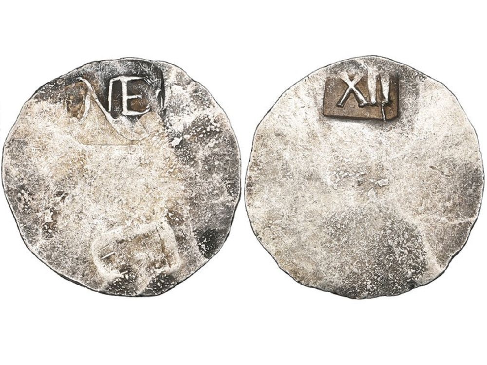 Simple coin with NE on one side and XII on the other