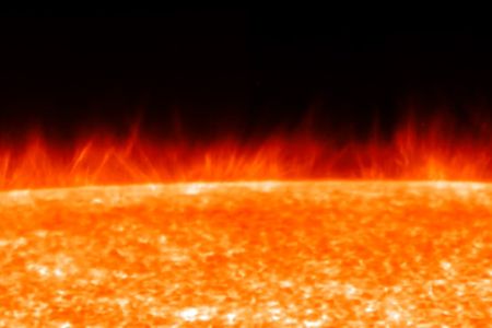 The thread-like structures in this image from the Japanese satellite Hinode are spicules, giant plumes of gas that transfer energy through the sun’s various regions.