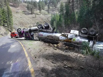 Fortunately, the driver suffered only minor injuries when a tanker truck of salmon rolled onto its roof in Oregon.