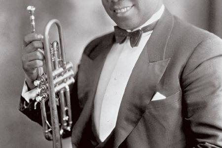 Louis Armstrong (at about 26 c. 1927) "as showing the world what jazz was all about," Driggs says.