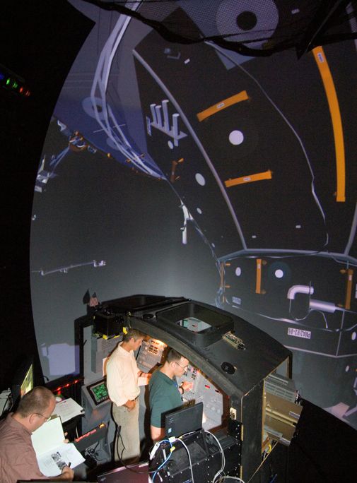 Astronauts train for the next shuttle mission.