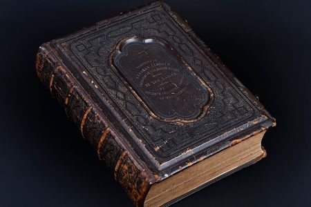 The hand-tooled leather cover