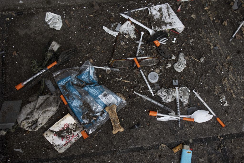Used needles and other paraphernalia on the ground