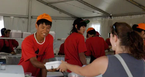 A visitor samples southeast Asian food at the 2011 Smithsonian Folklife Festival