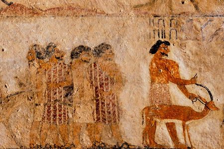 Wall art dated to around 1900 B.C. shows visitors to Egypt wearing colorful robes distinct from the white clothing worn by locals.
