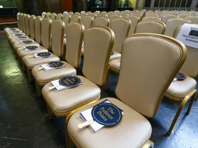 Chairs sit ready for the attendees of the ceremony recognizing 2020 and 2021 Pulitzer Prize winners.