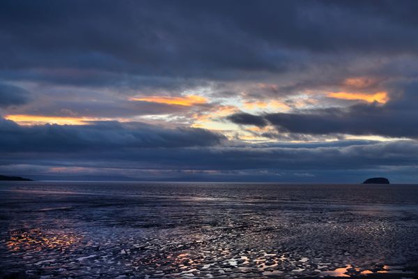 Subtle sky colours reflected in a mud flat. thumbnail