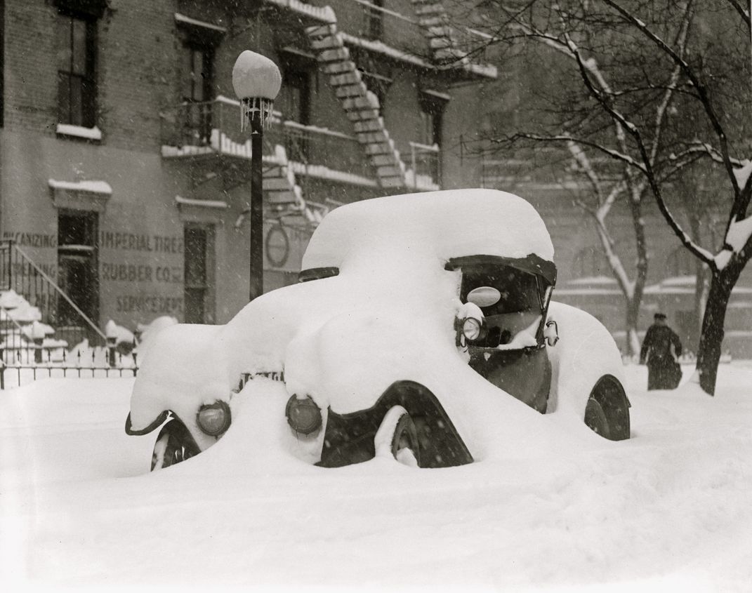 View of a car buried under snow during the Knickerbocker Storm
