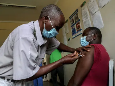 A man receives a Covid-19 vaccine in Zimbabwe.