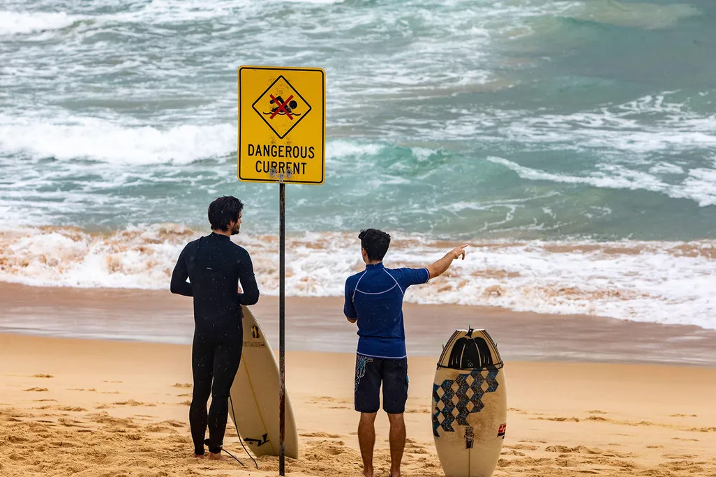 Surfers Standing on Beach