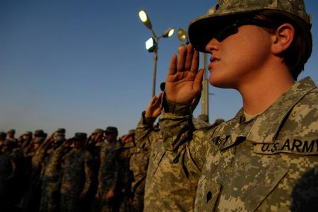 U.S. Army Spc. Amanda Vasquez, with Headquarters and Headquarters Troop, 3rd Heavy Brigade Combat Team, 1st Cavalry Division, salutes the flag in 2009. 