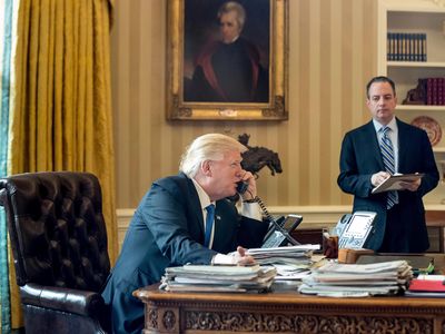 President Donald Trump, accompanied by Chief of Staff Reince Priebus, speaks on the phone with Russian President Vladimir Putin.