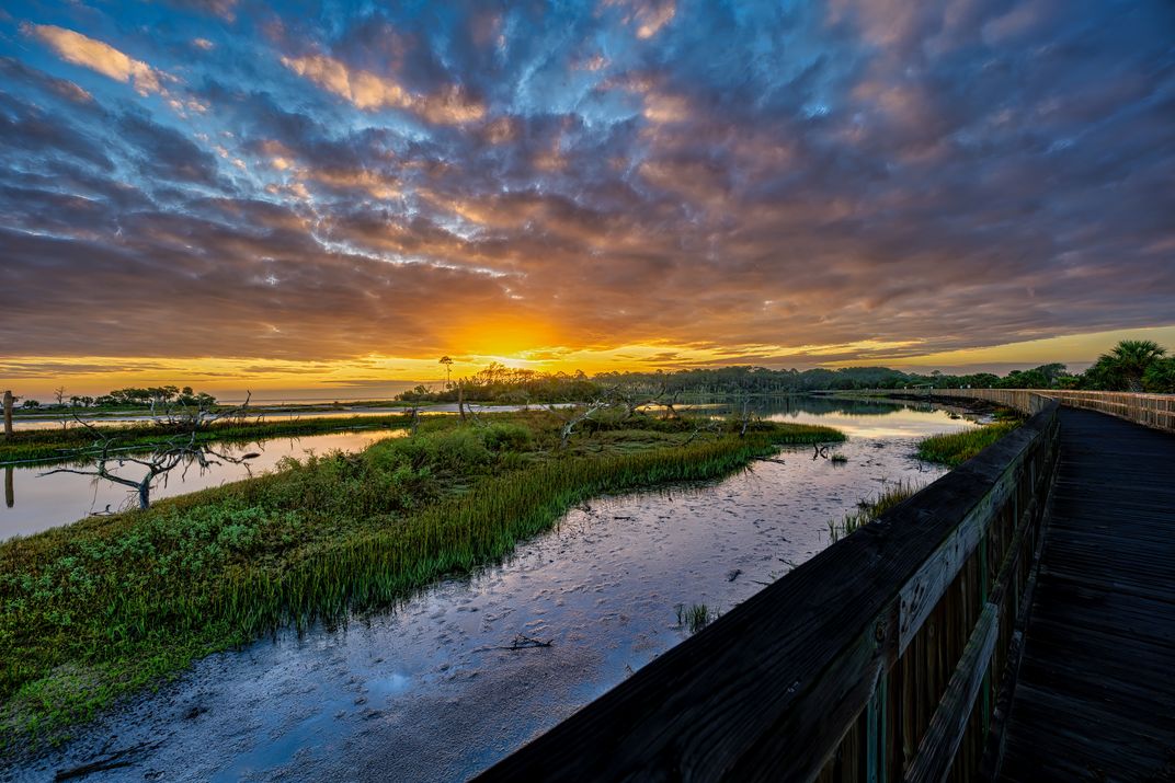 Sunrise over Big Talbot State Park while walking the bird observation ...