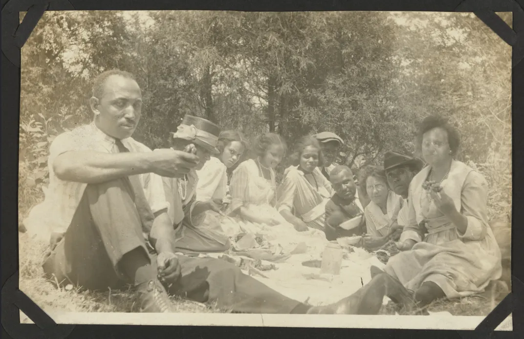 Group of people having a picnic in the 1920s