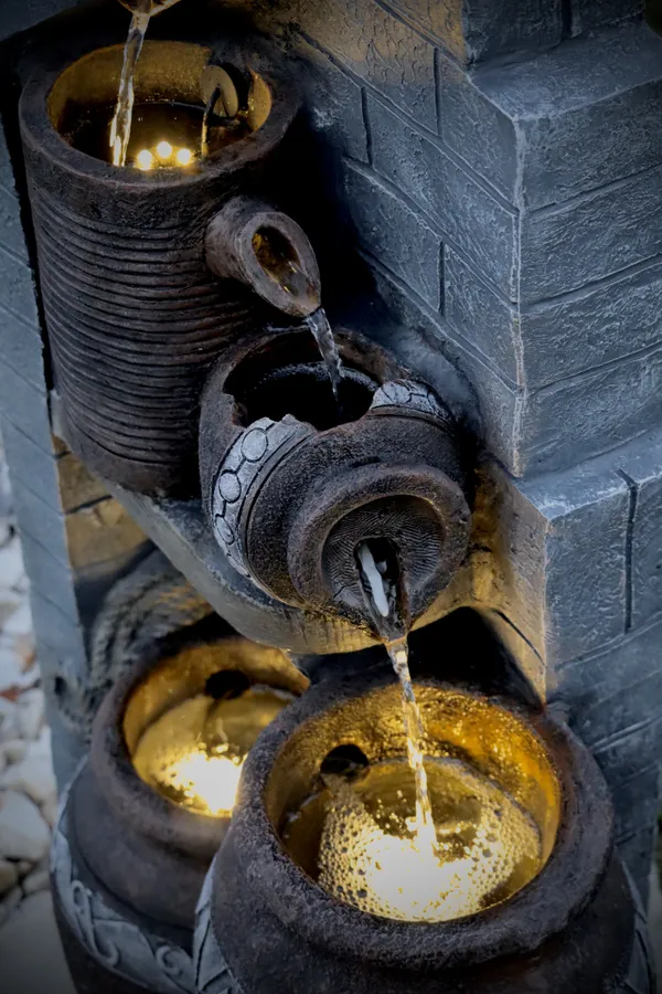 Ceramic vase fountain at sunset thumbnail