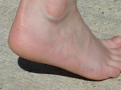 There are pros and cons to running barefoot.