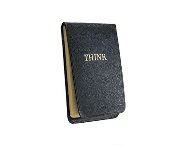 A 4.5-by 3-inch paper notepad with the word THINK embossed on its leather cover resides in the Smithsonian Institution's collections.