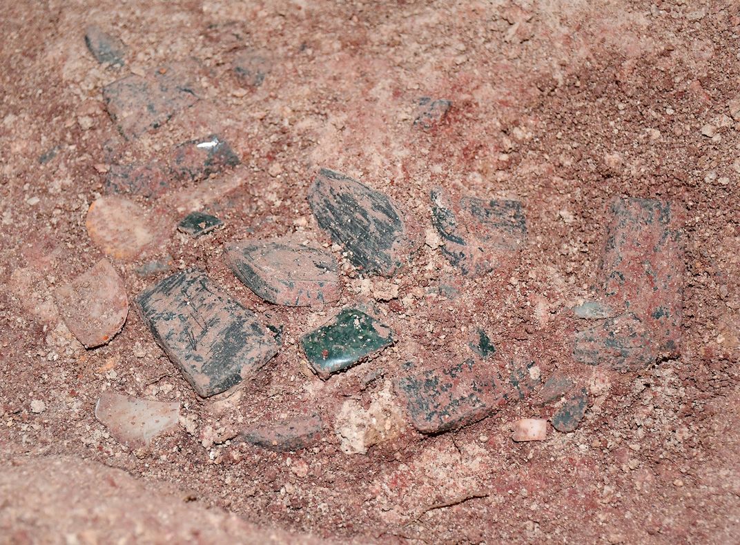 The mask fragments found in the tomb of Te K’ab Chaak. Diane carefully drew each piece, and Arlen used the photos and her drawings to reassemble the mask before gluing the pieces to a backing.
