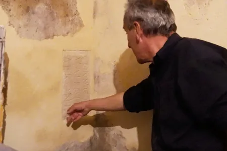 Artist Jean Charles Blais and his contractor discovered the engraving behind a layer of plaster on his studio wall.