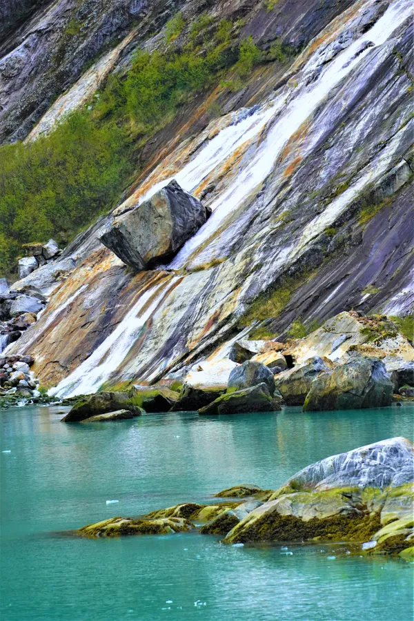 Large block of stone in a cascading stream in Tracy Arm Fjord. thumbnail