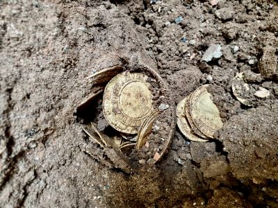 An anonymous couple found the trove of coins while renovating their house in 2019.