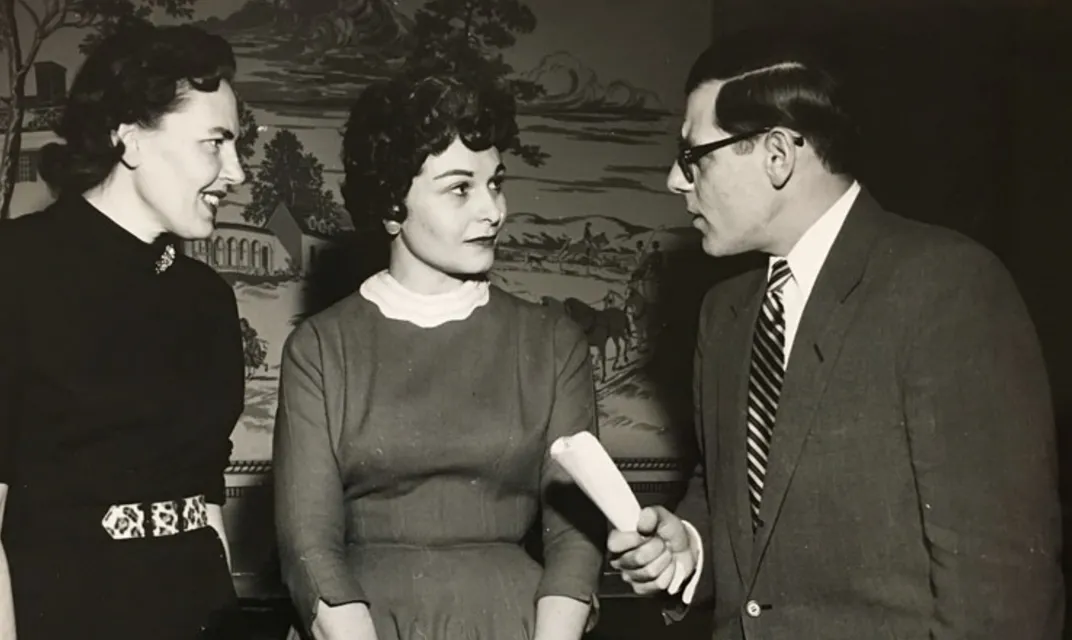 Cora Gay Carr (middle) and Floyd Zulli (right) at a reception for "Sunrise Semester" students in January 1958