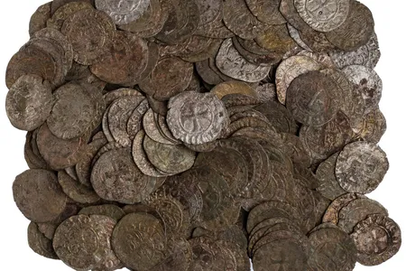 A display of low-value coins from Greece helps illustrate how money became part of ordinary peoples' everyday lives during economic transformation in medieval Europe.