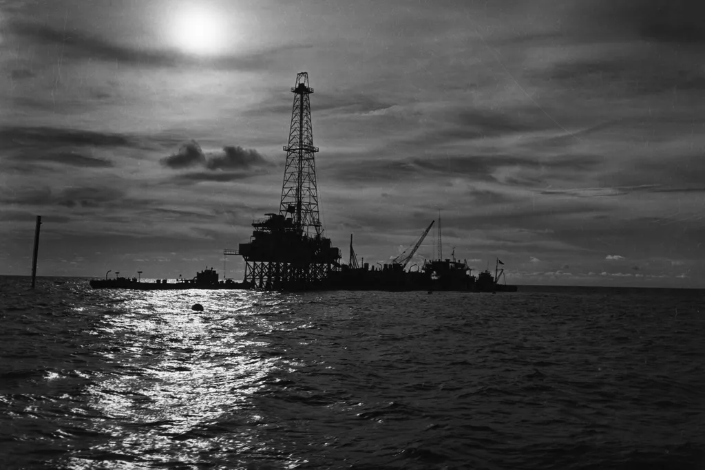 an oil well seen above the water