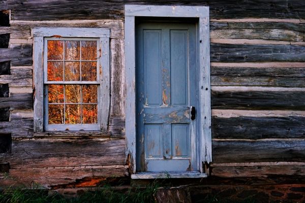 Fall reflection in a window of an old homestead thumbnail