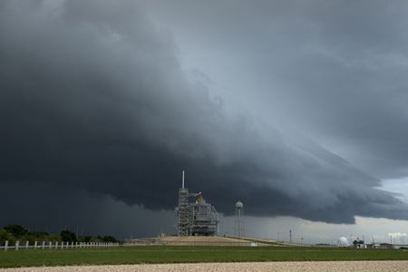 Storm clouds approach Launch Pad 39A at NASA's Kennedy Space Center in Florida on Friday, July 10, 2009 as space shuttle Endeavour stands awaiting Saturday's planned launch of the STS-127 mission.  Photo Credit: (NASA/Bill Ingalls)
