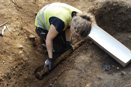The 1,100-year-old sword found in Norway measures about three feet long.
