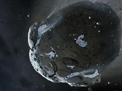 An artist’s depiction of the newly discovered ice-rich, rocky asteroid that was ripped apart by the distant white dwarf star 200 million years ago.
