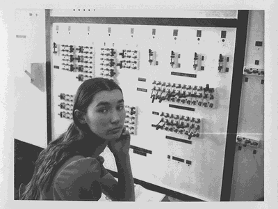 Dawn LeClair, member of the 1975 Wickenburg High School Math Club, sits in front of the paper clip computer.